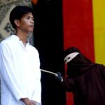 Woman passes out after she and her partner were flogged 100 times each for having s£x outside marriage under Indonesian province’s Sharia law Woman passes out after she and her partner were flogged 100 times each for having s£x outside marriage under Indonesian province’s Sharia law